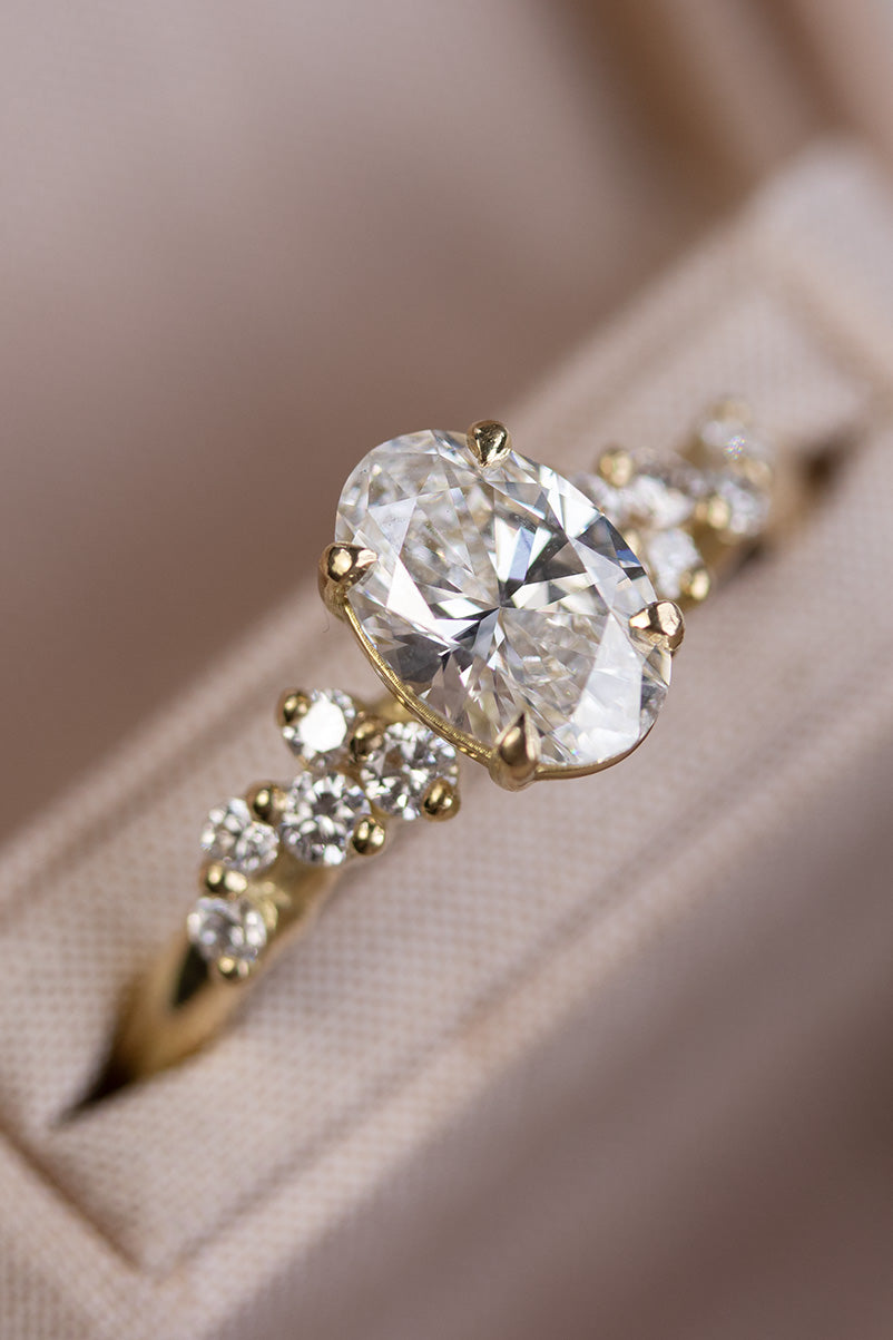 Bespoke lab-grown diamond engagement ring handcrafted in Lisbon atelier, featuring a sparkling solitaire with natural side diamonds.